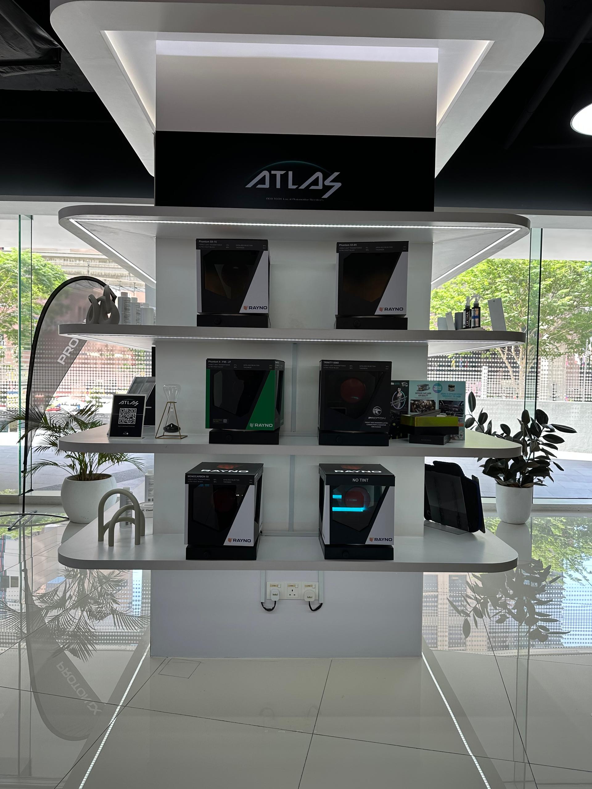 Rayno window film product boxes displayed on showroom shelves